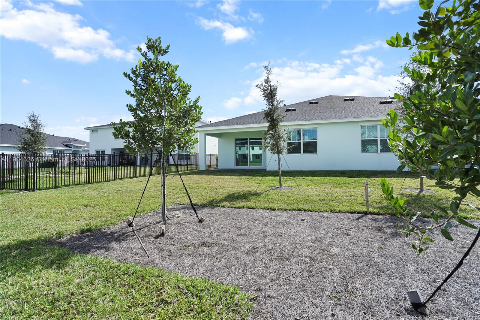 19655 Barn Swallow Way, Unit 19655 West Palm Beach, FL 33470 - Photo 37 of 59 a view of a house with a backyard