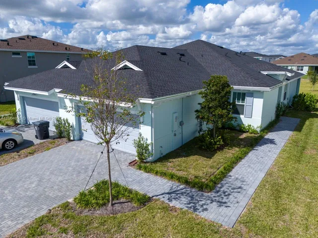 an aerial view of a house with a swimming pool