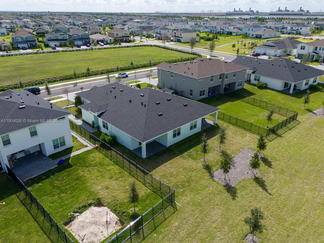 19655 Barn Swallow Way, Unit 19655 West Palm Beach, FL 33470 - Photo 47 of 59 an aerial view of a house with a swimming pool yard and outdoor seating