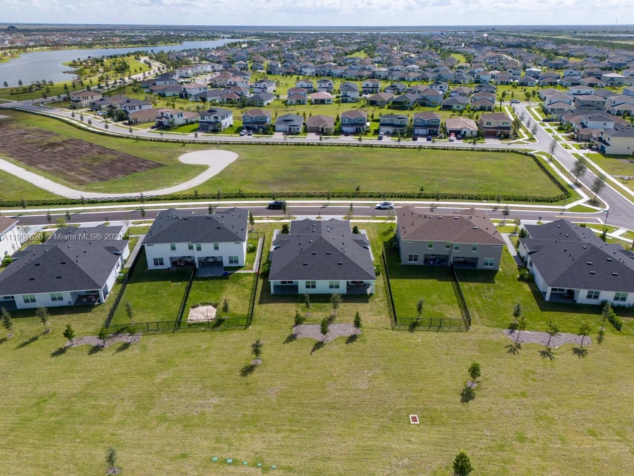19655 Barn Swallow Way, Unit 19655 West Palm Beach, FL 33470 - Photo 48 of 59 an aerial view of residential houses with outdoor space and swimming pool