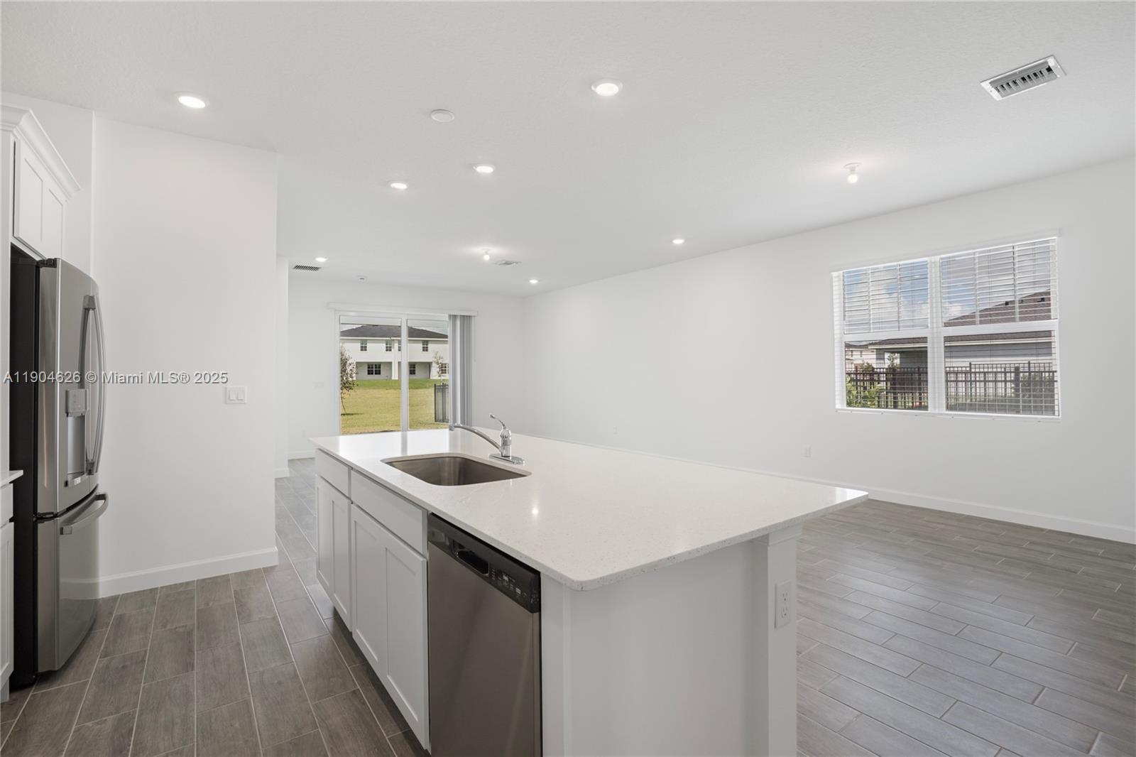 19655 Barn Swallow Way, Unit 19655 West Palm Beach, FL 33470 - Photo 7 of 59 a kitchen with a sink stove and refrigerator