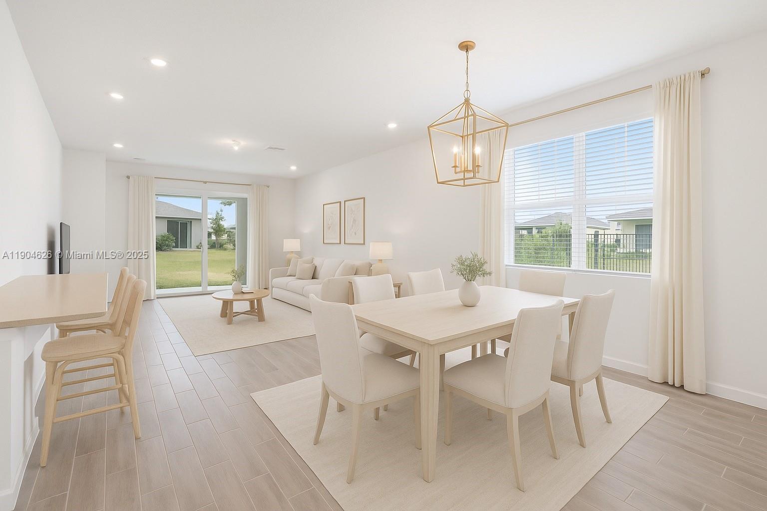 19655 Barn Swallow Way, Unit 19655 West Palm Beach, FL 33470 - Photo 10 of 59 a view of a dining room with furniture window and outside view