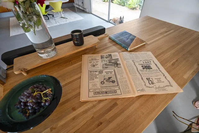 a bedroom with a bed and a large window with balcony view