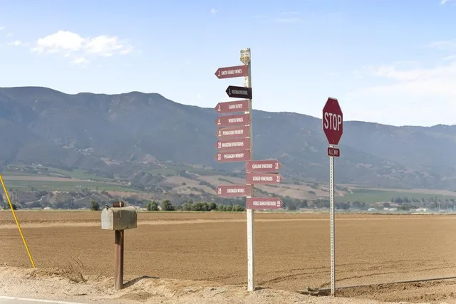a living room with furniture a window and a table