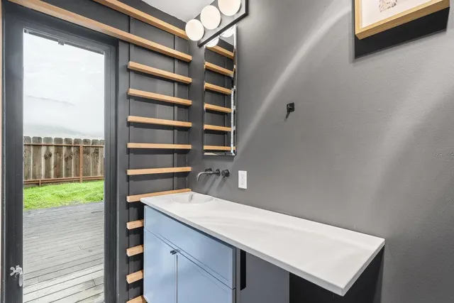 a view of a backyard with wooden fence