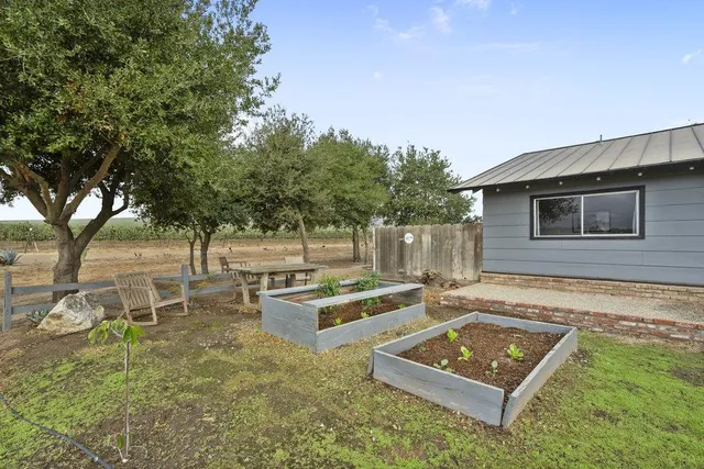 an aerial view of a houses with outdoor space