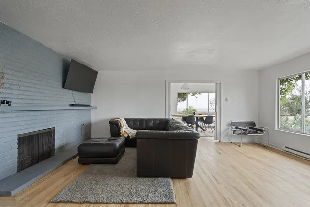 a view of a dining room with furniture window and wooden floor