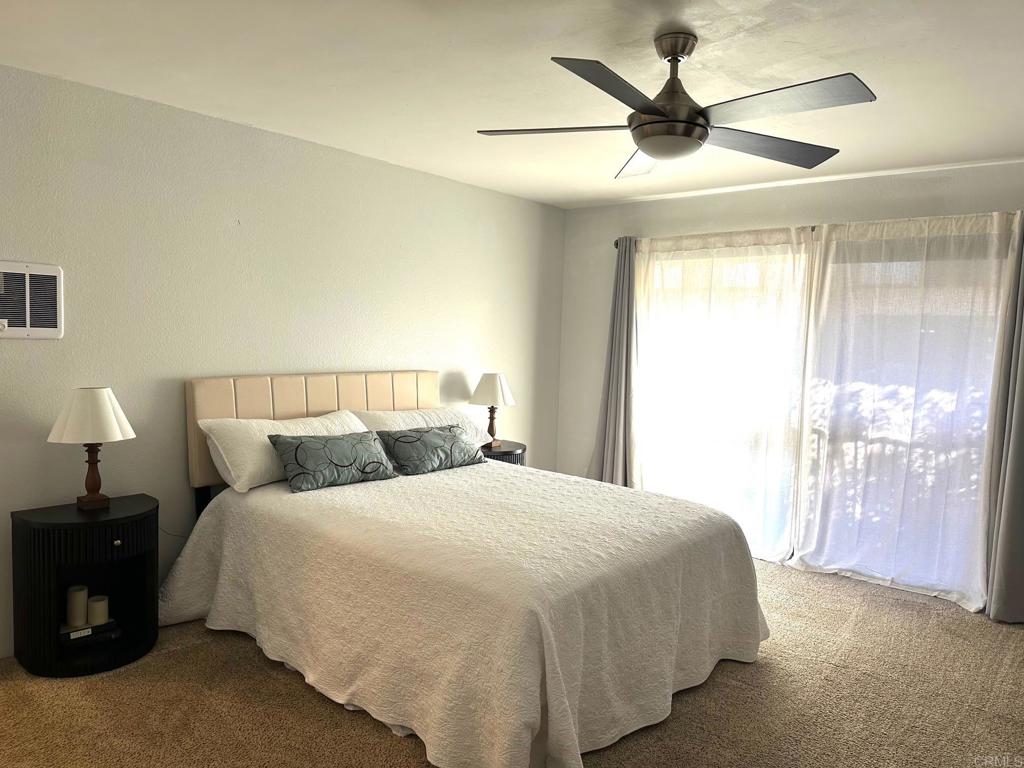 4253 Fifth Avenue San Diego, CA 92103 - Photo 11 of 22 a bedroom with a bed and a lamp