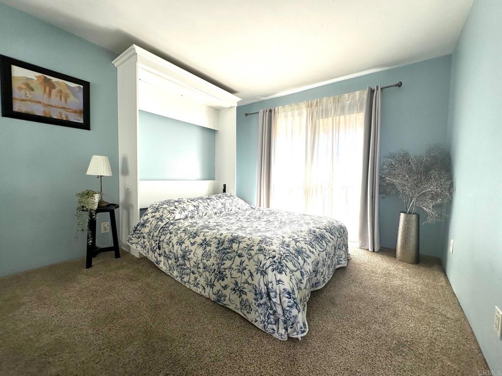 4253 Fifth Avenue San Diego, CA 92103 - Photo 16 of 22 a bedroom with a bed and a painting on the wall