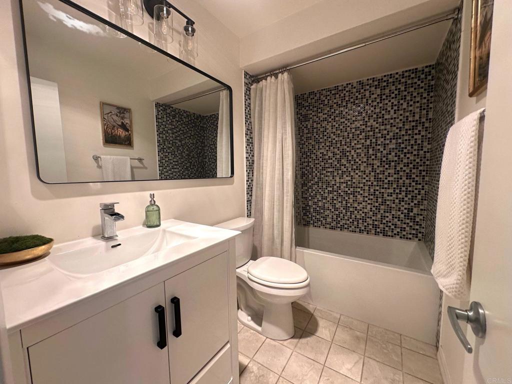 4253 Fifth Avenue San Diego, CA 92103 - Photo 17 of 22 a bathroom with a sink a toilet and shower
