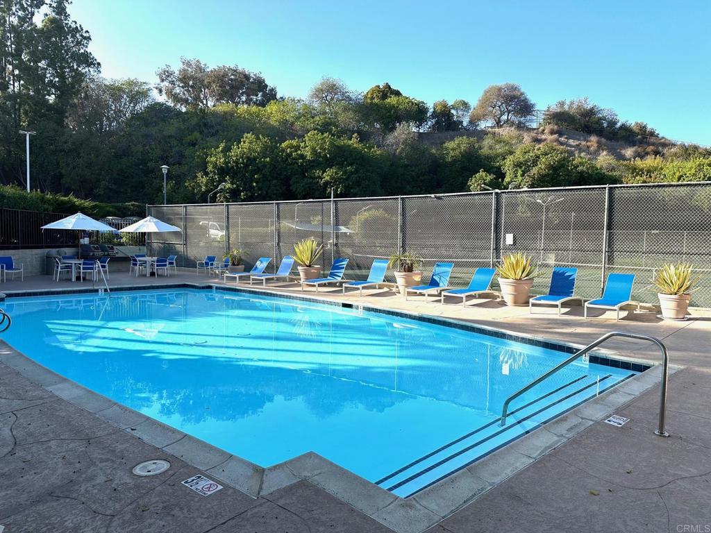 4253 Fifth Avenue San Diego, CA 92103 - Photo 19 of 22 a view of a swimming pool with a lounge chair