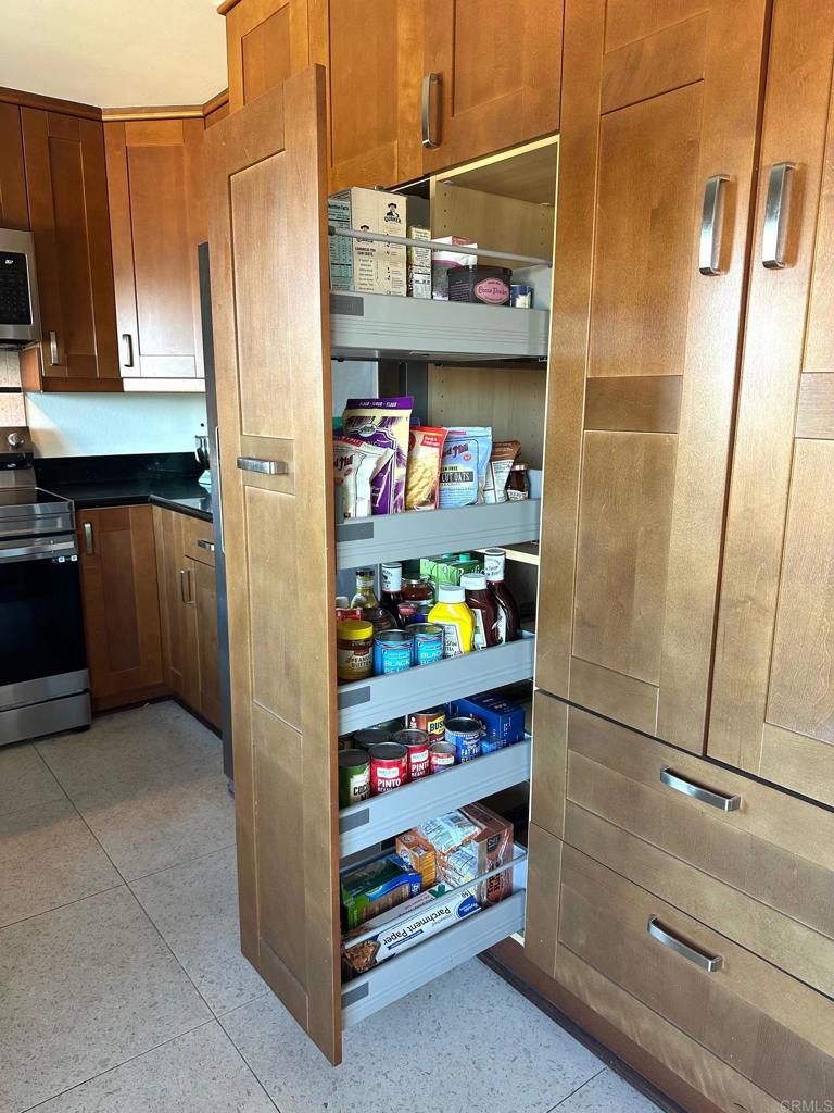 4253 Fifth Avenue San Diego, CA 92103 - Photo 9 of 22 a kitchen with stainless steel appliances a refrigerator and cabinets