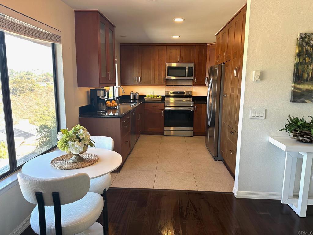 4253 Fifth Avenue San Diego, CA 92103 - Photo 10 of 22 a kitchen with a refrigerator and a stove