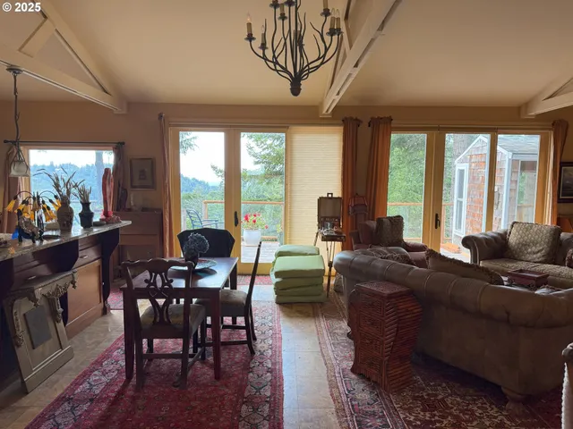 a living room with furniture and large windows