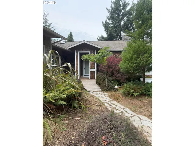a backyard of a house with yard and outdoor seating