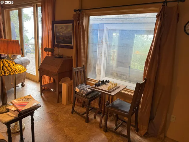 a dining room with furniture and window