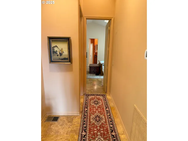 a view of walk in closet with clothes