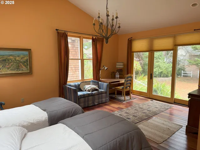 a bathroom with a granite countertop sink and a toilet