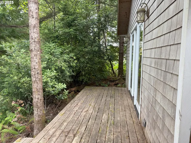 a view of backyard with wooden floor and outdoor space