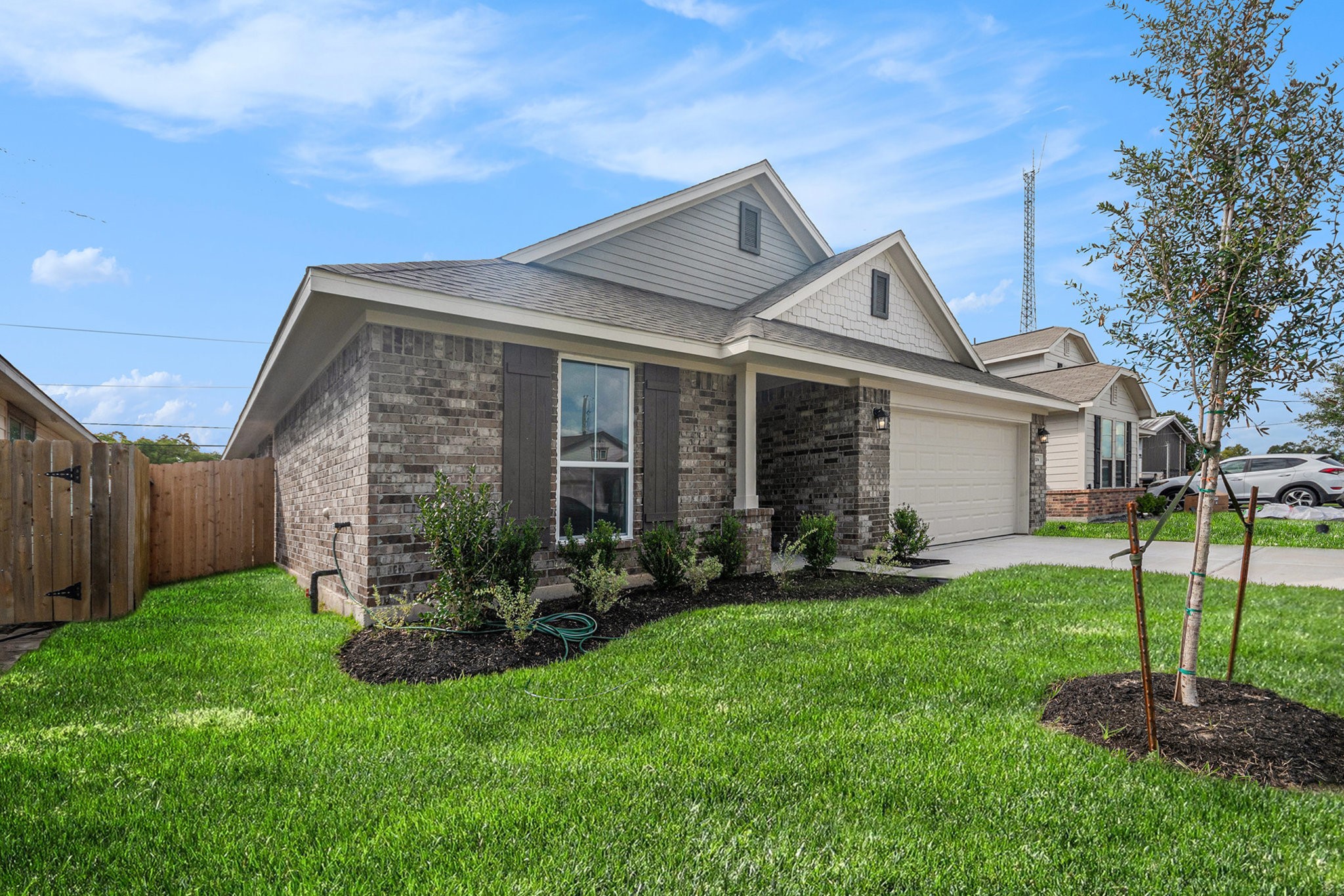 a front view of a house with a yard and porch