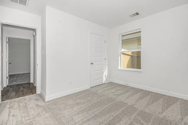 a view of an empty room and window