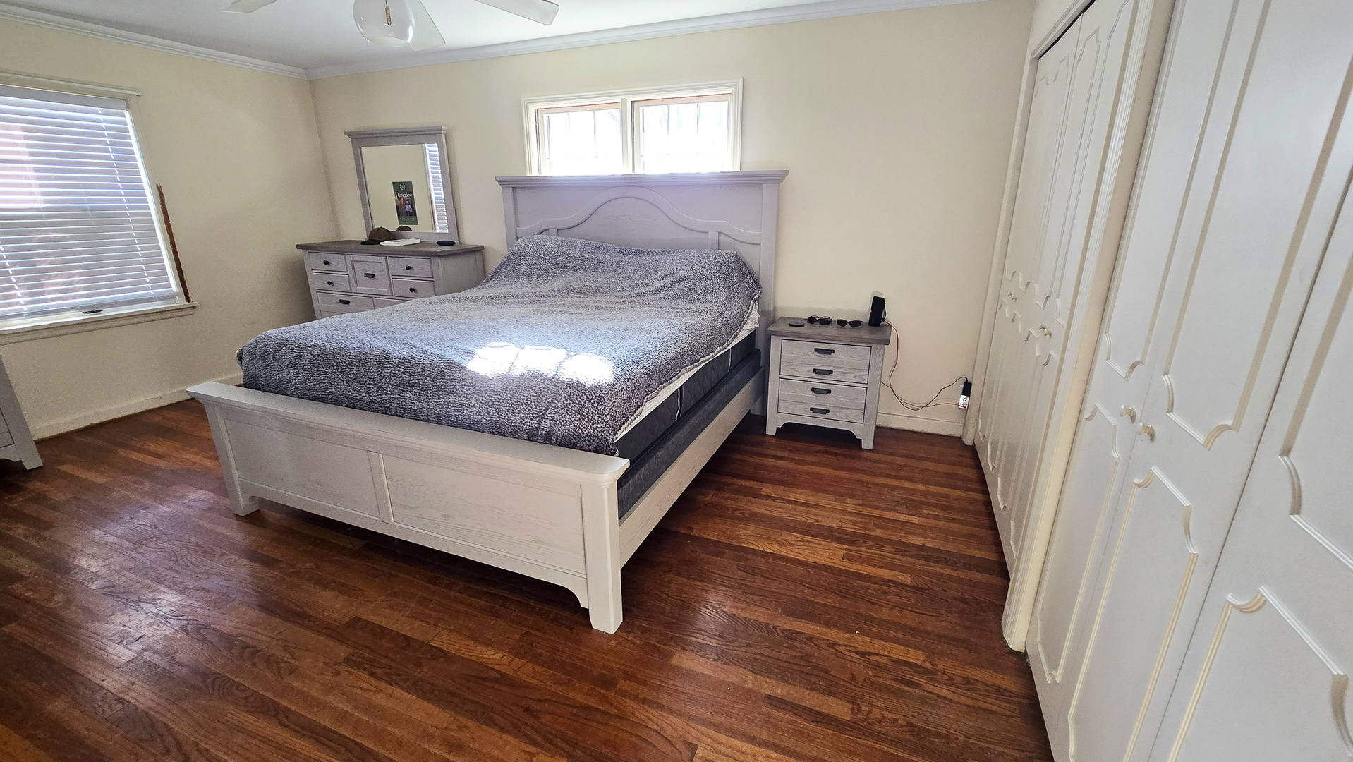 4 Lilac Lane Centralia, IL 62801 - Photo 17 of 32 a spacious bedroom with a bed and wooden floor