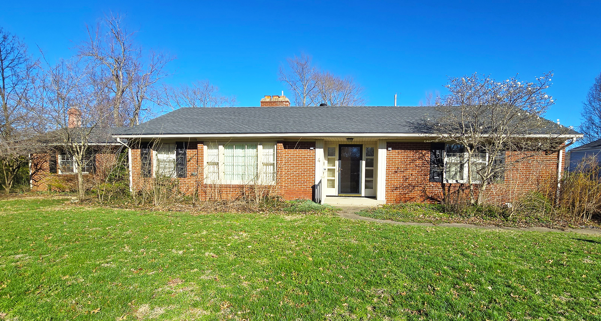 4 Lilac Lane Centralia, IL 62801 - Photo 2 of 32 a front view of a house with a yard table and chairs