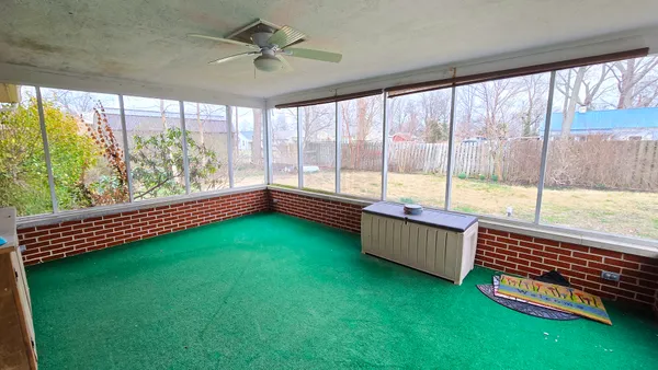 a room with window and pool table