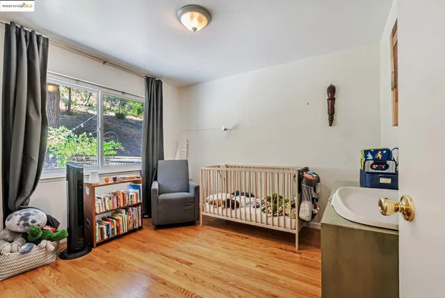a bedroom with furniture and a window
