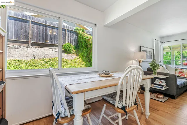 a view of a dining room with furniture window and outside view