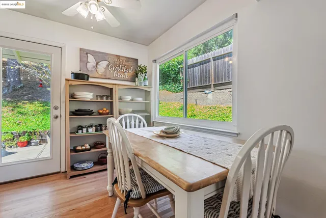 a dining room with furniture and window