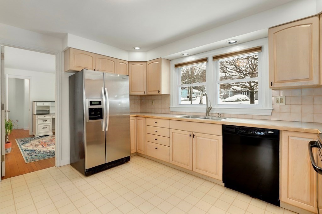 43 Montview Road Chelmsford, MA 01824 - Photo 11 of 40 a kitchen with granite countertop a refrigerator stove top oven and sink
