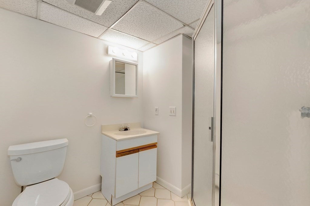 43 Montview Road Chelmsford, MA 01824 - Photo 26 of 40 a white toilet sitting next to a bathroom sink