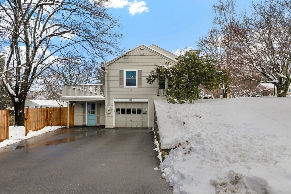 43 Montview Road Chelmsford, MA 01824 - Photo 27 of 40 a view of a house with a yard covered in snow