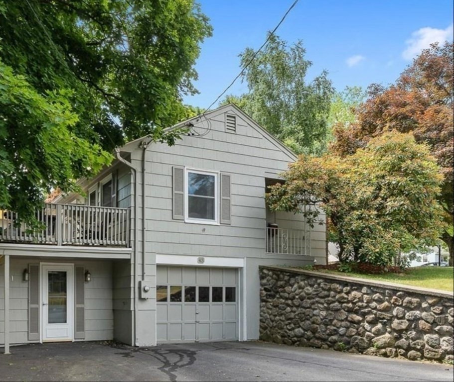 43 Montview Road Chelmsford, MA 01824 - Photo 37 of 40 a front view of a house with a tree