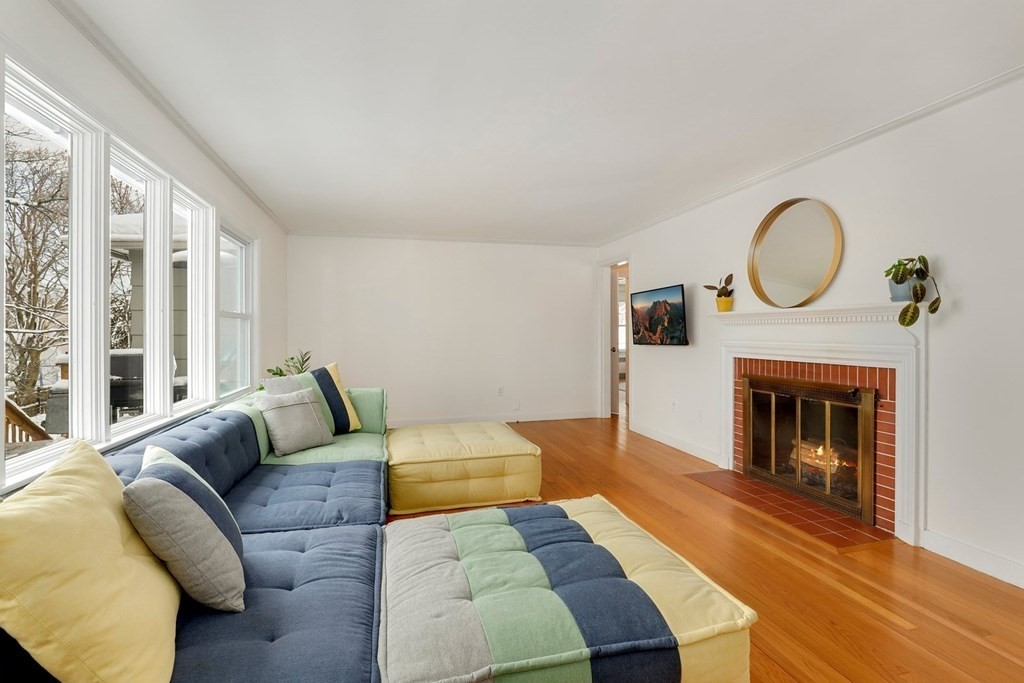 43 Montview Road Chelmsford, MA 01824 - Photo 4 of 40 a living room with furniture and a fireplace