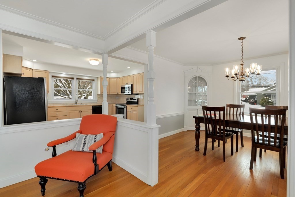43 Montview Road Chelmsford, MA 01824 - Photo 7 of 40 a view of a dining room with furniture wooden floor and a chandelier