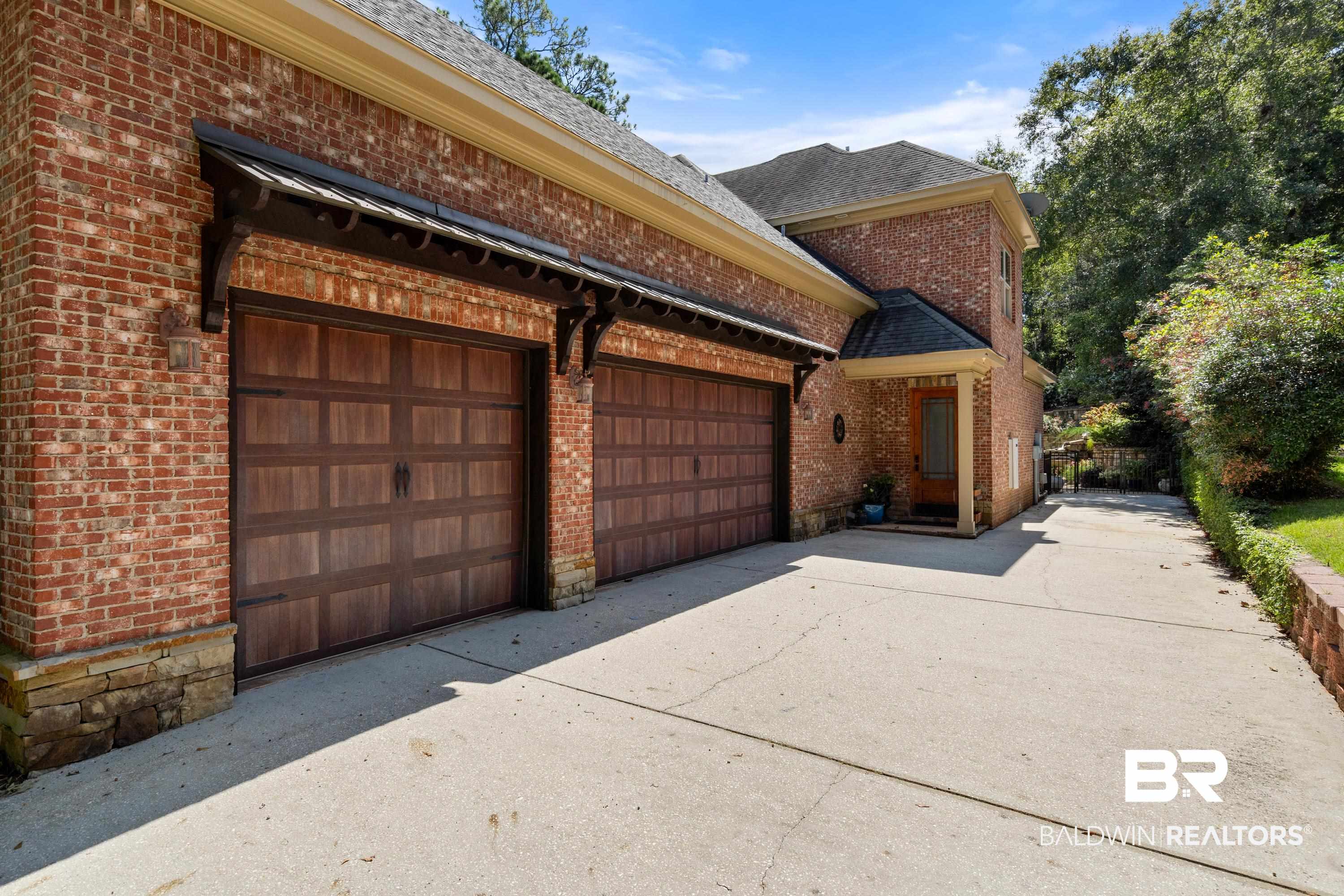 30057 Dolive Ridge Daphne, AL 36527 - Photo 3 of 55 View of home's exterior with a garage