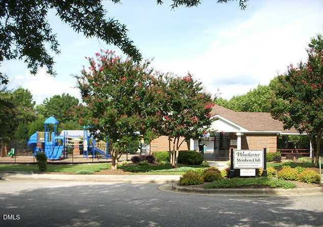 4500 Rivershyre Way Raleigh, NC 27616 - Photo 41 of 42 a front view of a house with a garden and tree