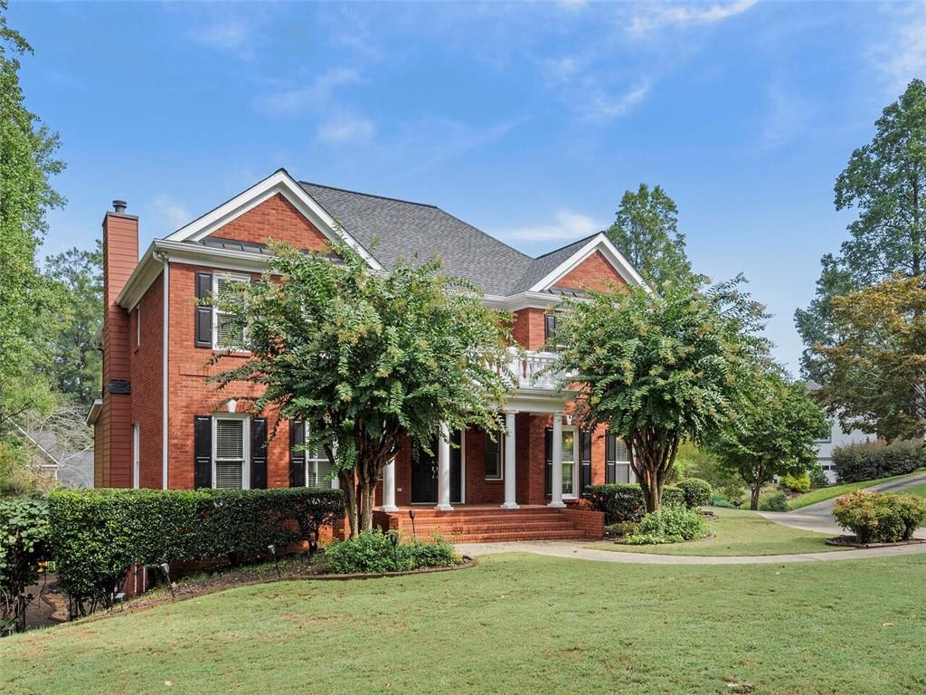 988 Grantham Way Southwest Marietta, GA 30064 - Photo 1 of 1 a front view of a house with a yard