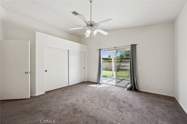 a bathroom with a sink a toilet a mirror and shower