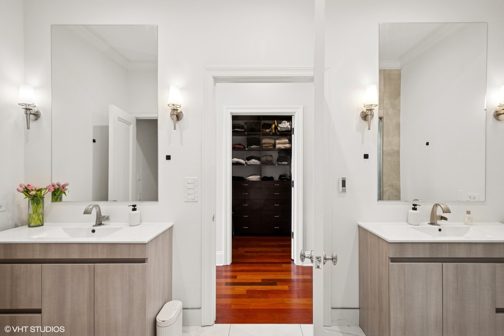1759 West Surf Street Chicago, IL 60657 - Photo 19 of 43 a bathroom with a sink and a mirror