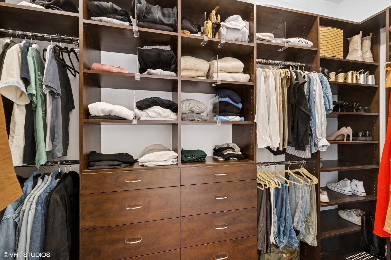 1759 West Surf Street Chicago, IL 60657 - Photo 20 of 43 a view of walk in closet with clothes and shoes
