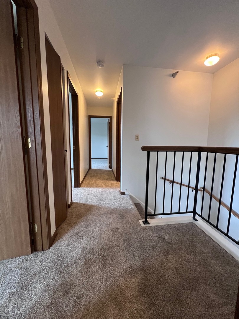 1350 Orleans Drive, Unit 1350 Mundelein, IL 60060 - Photo 16 of 26 a view of a hallway