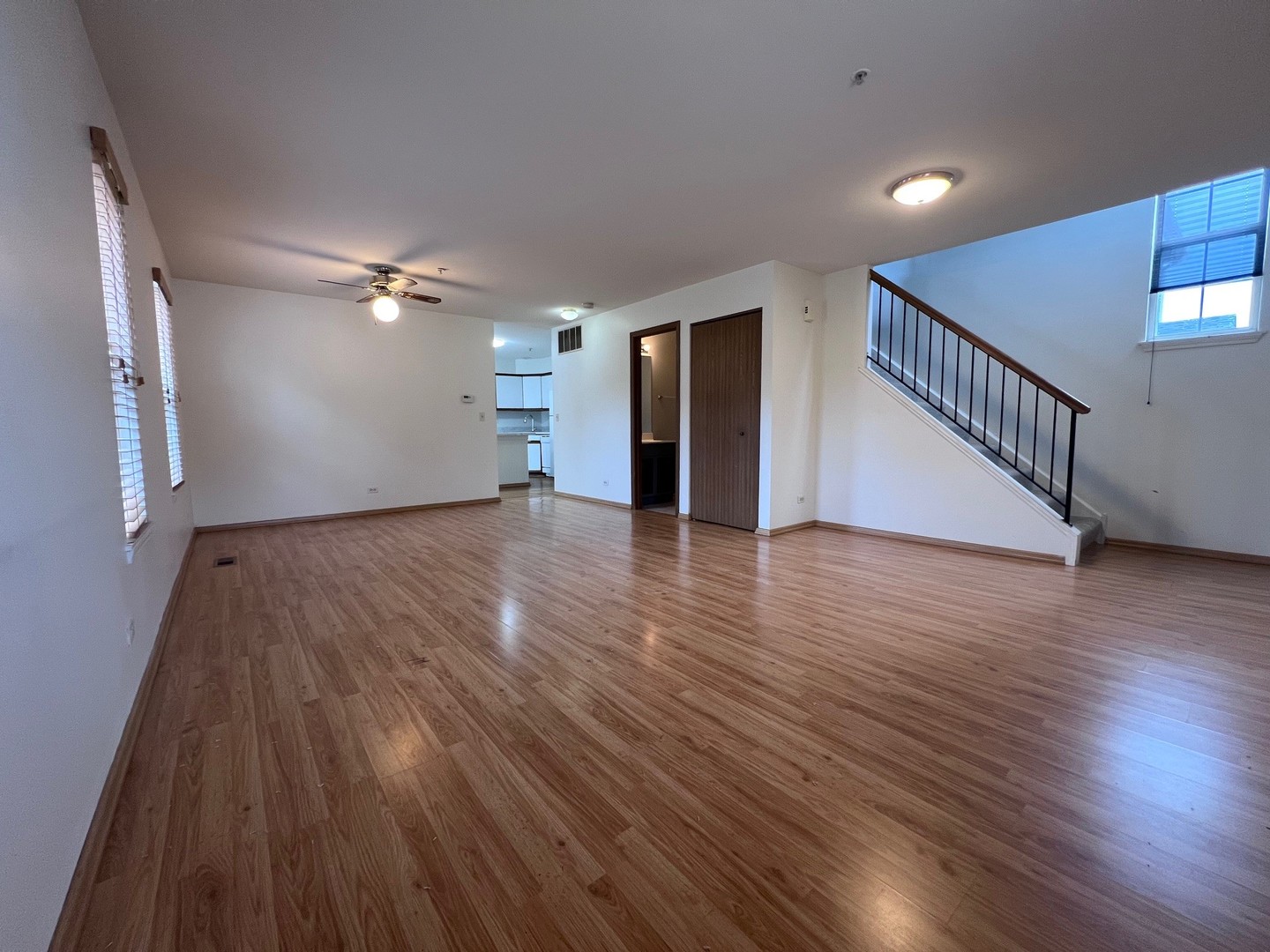 1350 Orleans Drive, Unit 1350 Mundelein, IL 60060 - Photo 8 of 26 a view of an empty room with wooden floor and a window