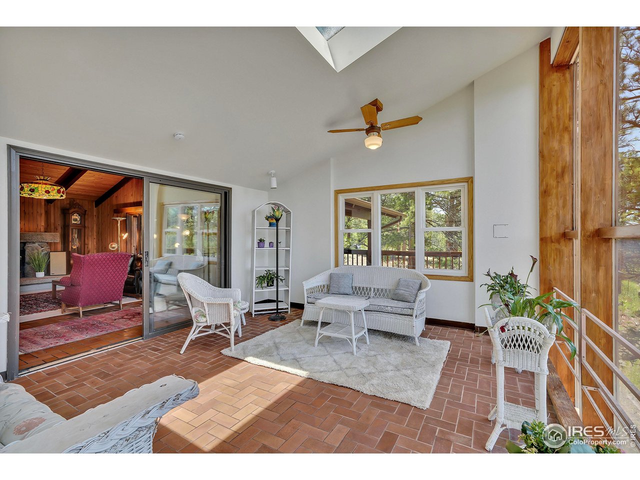 474 Leonards Road Boulder, CO 80302 - Photo 12 of 40 a living room with furniture and wooden floor