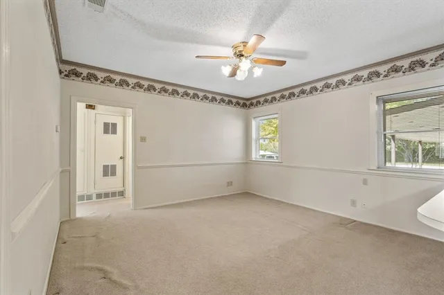 a kitchen with a sink cabinets stainless steel appliances and wooden floor