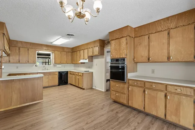 a view of a kitchen with a closet and a ceiling fan