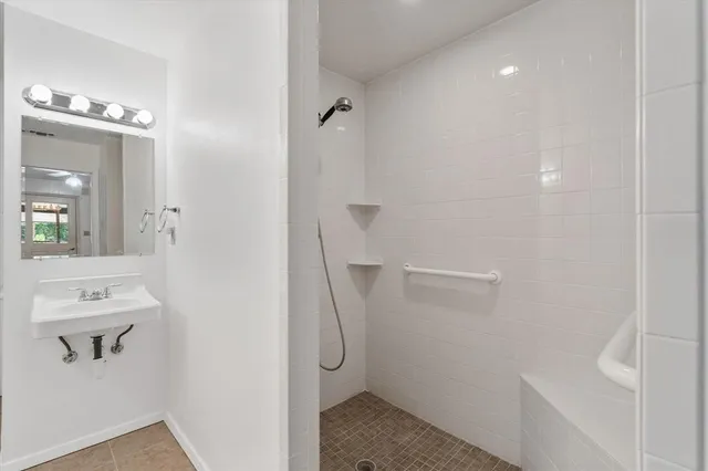 a bathroom with a sink a vanity and a mirror