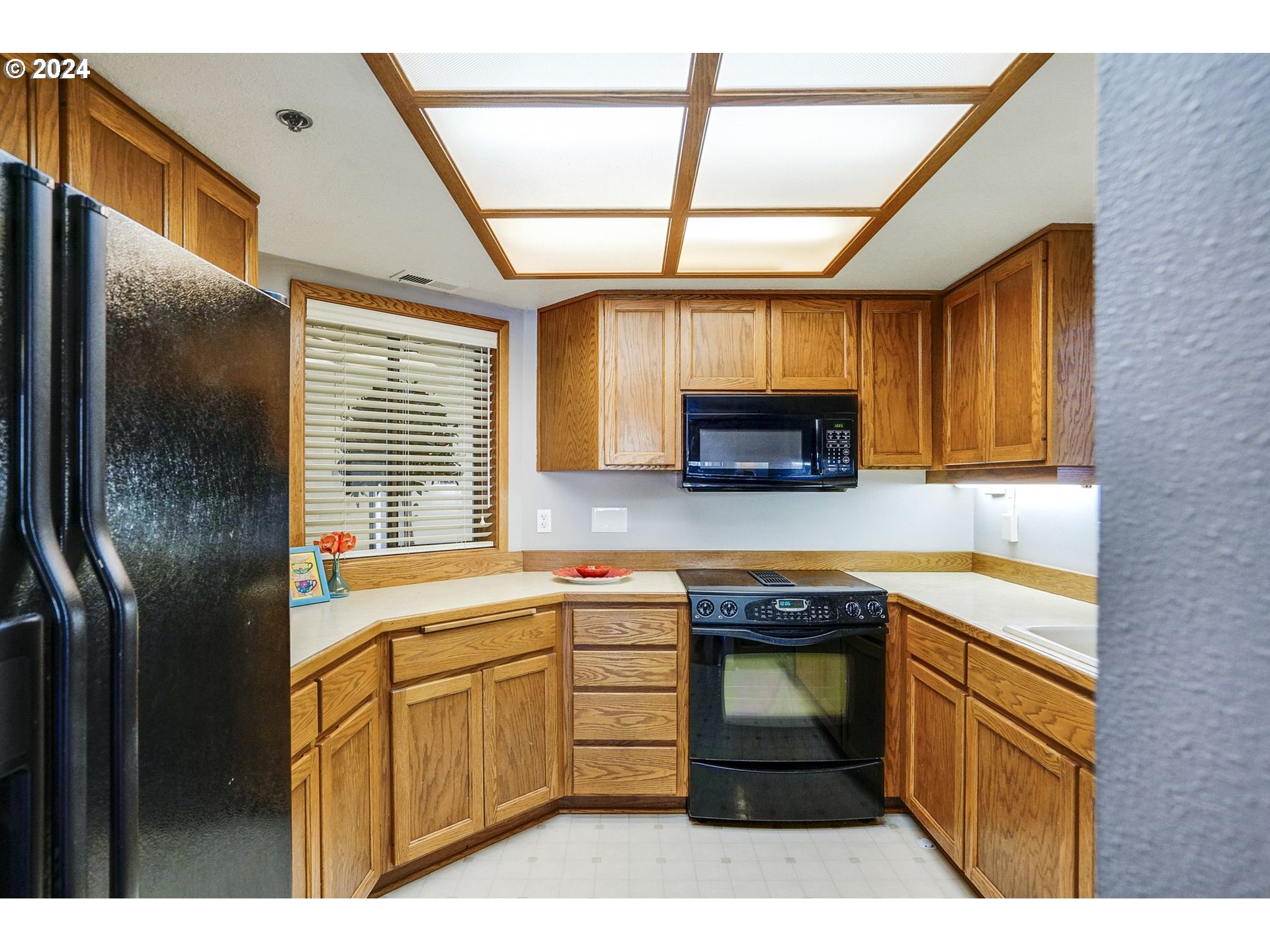 652 Wimbledon Court Eugene, OR 97401 - Photo 11 of 35 a kitchen with stainless steel appliances granite countertop a sink a stove and cabinets